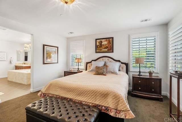 16210 Bluestar Way, San Diego, CA 92127 - carpeted bedroom featuring connected bathroom and a chandelier