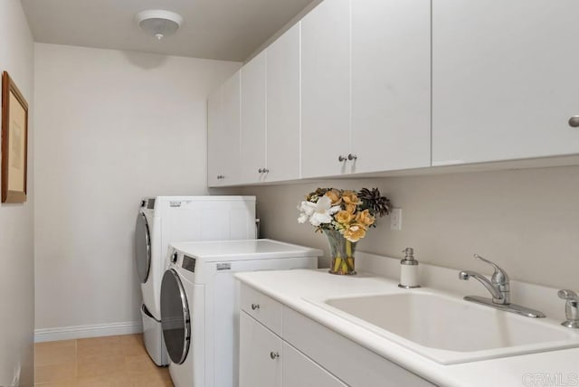 16210 Bluestar Way, San Diego, CA 92127 - washroom featuring washing machine and dryer, cabinet space, and light tile patterned floors