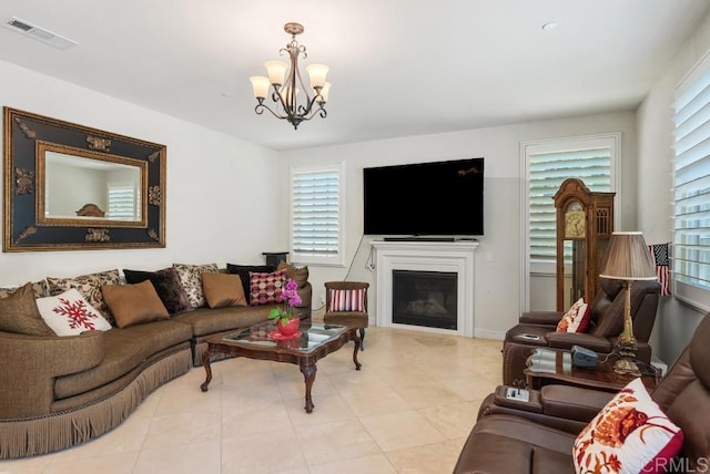 16210 Bluestar Way, San Diego, CA 92127 - living area with a chandelier, healthy amount of natural light, tile patterned flooring, and a glass covered fireplace