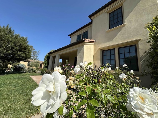 16210 Bluestar Way, San Diego, CA 92127 - view of side of property featuring stucco siding and a yard