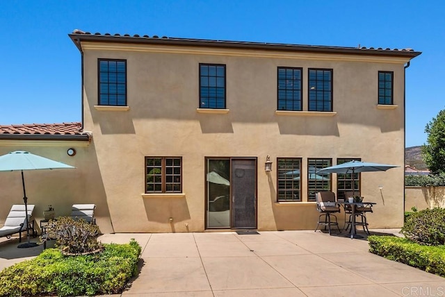 16210 Bluestar Way, San Diego, CA 92127 - rear view of house featuring a patio area, a tile roof, and stucco siding