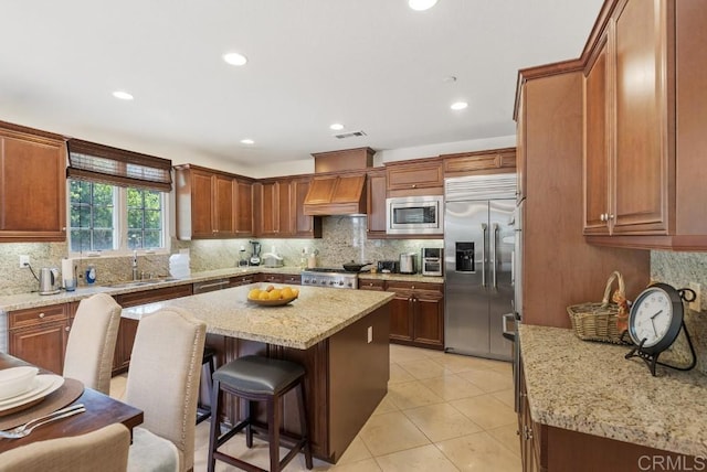 16210 Bluestar Way, San Diego, CA 92127 - kitchen with built in appliances, backsplash, a kitchen island, and recessed lighting