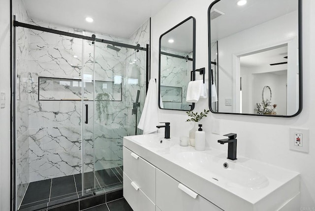 4862 Kesling Ct, San Diego, CA 92117 - bathroom with double vanity, a marble finish shower, and recessed lighting
