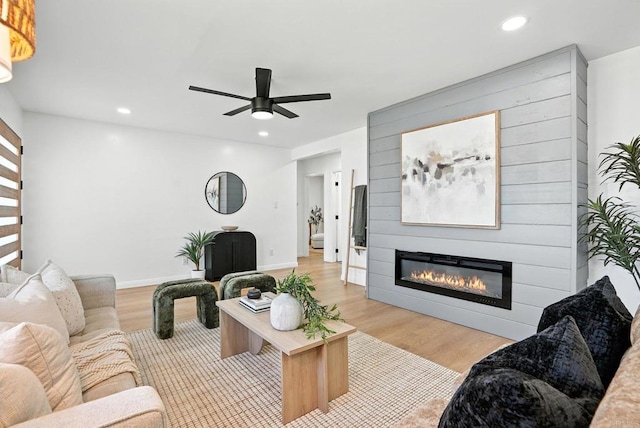 4862 Kesling Ct, San Diego, CA 92117 - living area featuring wood finished floors, ceiling fan, a fireplace, and recessed lighting