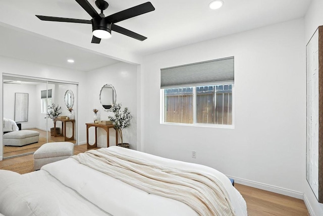 4862 Kesling Ct, San Diego, CA 92117 - bedroom with multiple windows, a closet, wood finished floors, recessed lighting, and a ceiling fan