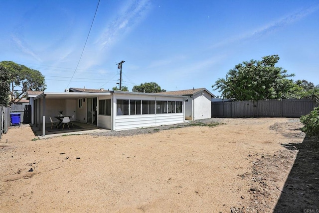 4862 Kesling Ct, San Diego, CA 92117 - back of property with a sunroom, a fenced backyard, and a patio