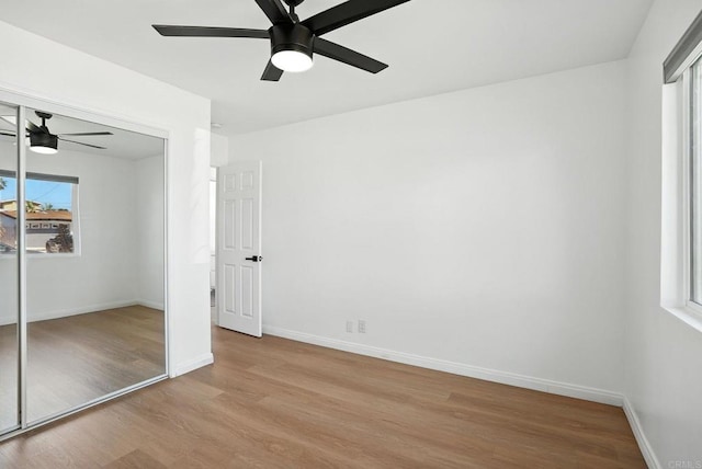 4862 Kesling Ct, San Diego, CA 92117 - unfurnished bedroom with wood finished floors, a closet, and ceiling fan