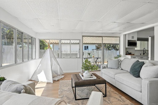 4862 Kesling Ct, San Diego, CA 92117 - sunroom with a drop ceiling, wood finished floors, and healthy amount of natural light