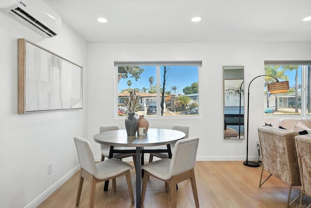4862 Kesling Ct, San Diego, CA 92117 - dining room featuring a wall mounted air conditioner, light wood-style flooring, and recessed lighting