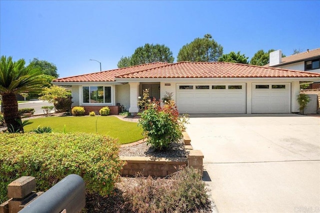 1879 Falconer Ct, Vista, CA 92081 - view of front of property with an attached garage, concrete driveway, a tiled roof, a front yard, and stucco siding