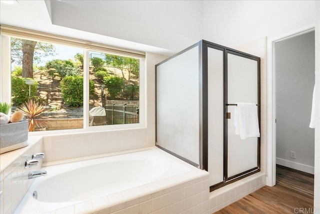 1879 Falconer Ct, Vista, CA 92081 - full bathroom with a garden tub, a stall shower, and wood finished floors