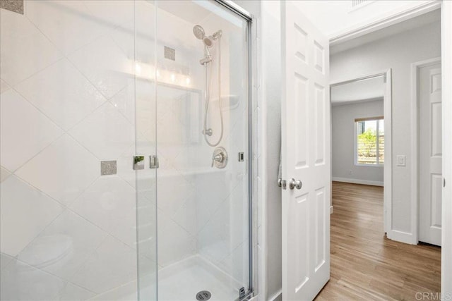 1879 Falconer Ct, Vista, CA 92081 - full bath with a stall shower and wood finished floors