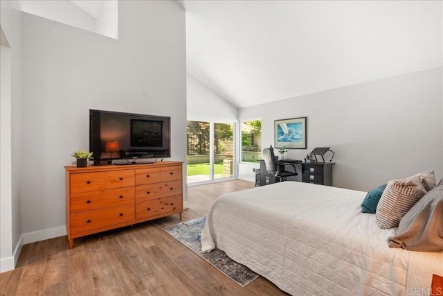 1879 Falconer Ct, Vista, CA 92081 - bedroom featuring high vaulted ceiling, access to exterior, and wood finished floors