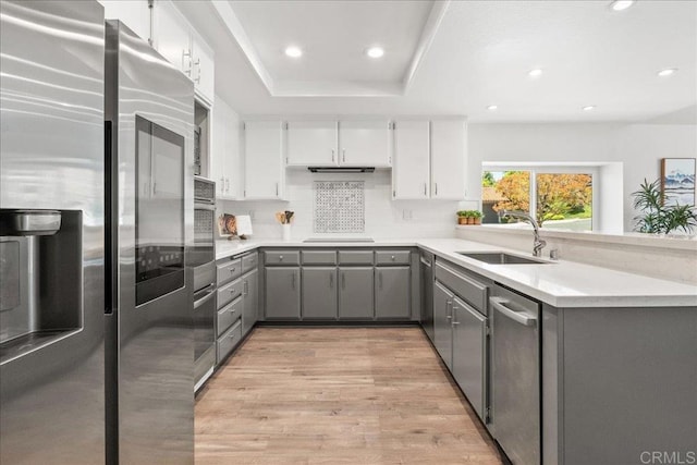1879 Falconer Ct, Vista, CA 92081 - kitchen featuring stainless steel appliances, gray cabinets, light wood-type flooring, tasteful backsplash, and recessed lighting