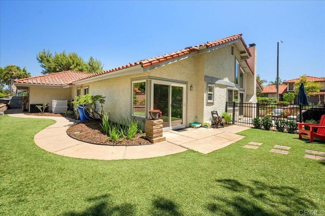 1879 Falconer Ct, Vista, CA 92081 - rear view of house with stucco siding, a tiled roof, and a patio area