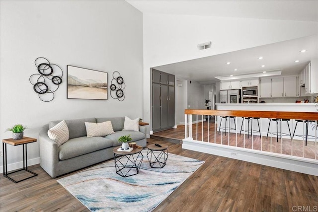 1879 Falconer Ct, Vista, CA 92081 - living area featuring wood finished floors, high vaulted ceiling, and recessed lighting