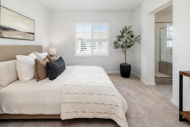 10667 Golden Willow Unit 152, San Diego, CA 92130 - carpeted bedroom with connected bathroom and baseboards