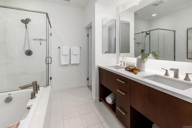 10667 Golden Willow Unit 152, San Diego, CA 92130 - bathroom featuring a shower stall, double vanity, tile patterned flooring, and a tub
