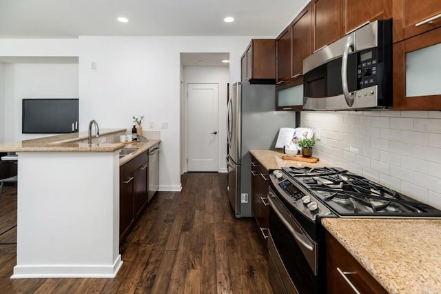 10667 Golden Willow Unit 152, San Diego, CA 92130 - kitchen with stainless steel appliances, dark wood-type flooring, light stone counters, and recessed lighting