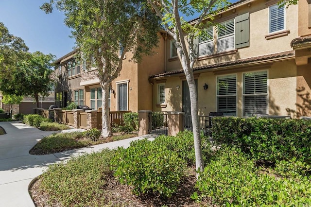 10667 Golden Willow Unit 152, San Diego, CA 92130 - view of front of house with stucco siding and a tiled roof