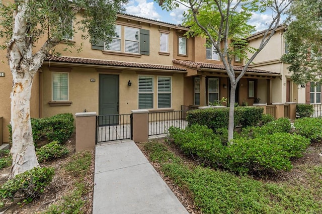 10667 Golden Willow Unit 152, San Diego, CA 92130 - multi unit property with stucco siding, a gate, and a tile roof