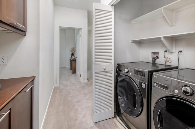 10667 Golden Willow Unit 152, San Diego, CA 92130 - laundry room with cabinet space, washing machine and dryer, and light colored carpet
