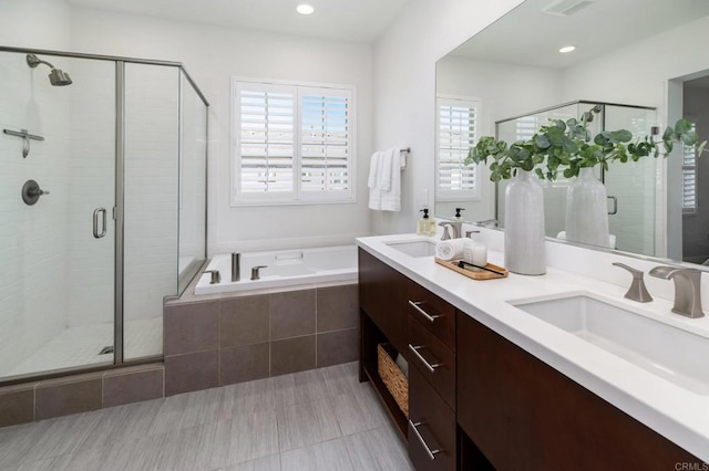 10667 Golden Willow Unit 152, San Diego, CA 92130 - bathroom featuring a bath, a shower stall, double vanity, and recessed lighting