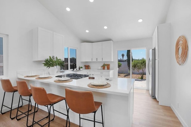 3939 Magnolia Rd, Oceanside, CA 92058 - kitchen with a peninsula, appliances with stainless steel finishes, healthy amount of natural light, light countertops, and recessed lighting