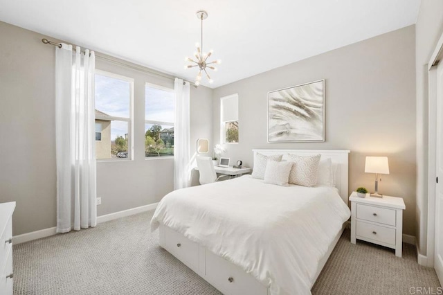 16755 Coyote Bush Dr Unit 15, San Diego, CA 92127 - bedroom with a chandelier and light carpet