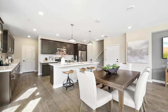 16755 Coyote Bush Dr Unit 15, San Diego, CA 92127 - dining area featuring stairs, wood finished floors, and recessed lighting