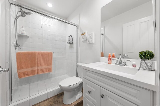 1925 Avenida Senecio Unit 2, Chula Vista, CA 91913 - bathroom with vanity, a stall shower, wood finished floors, and recessed lighting