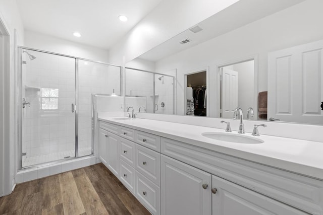 1925 Avenida Senecio Unit 2, Chula Vista, CA 91913 - full bathroom with double vanity, a stall shower, a spacious closet, recessed lighting, and wood finished floors