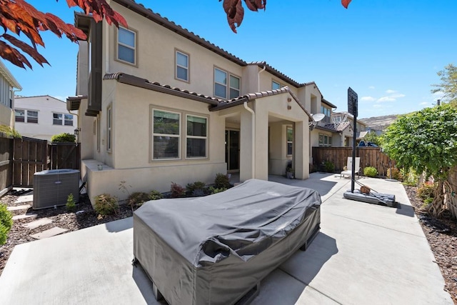 1925 Avenida Senecio Unit 2, Chula Vista, CA 91913 - back of house featuring a fenced backyard, a patio, stucco siding, and a tiled roof