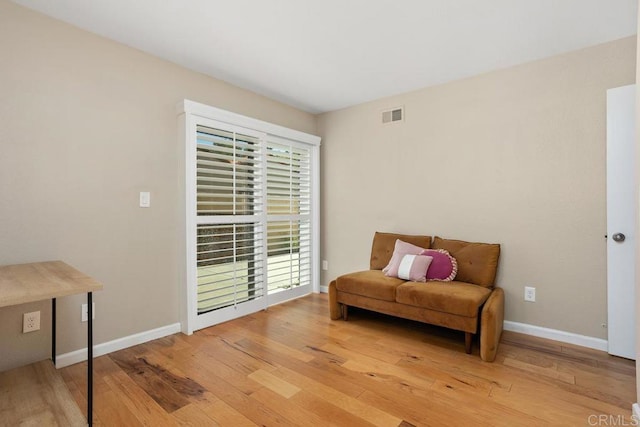 2072 Golden Circle Dr, Escondido, CA 92026 - living area featuring light wood-type flooring and baseboards
