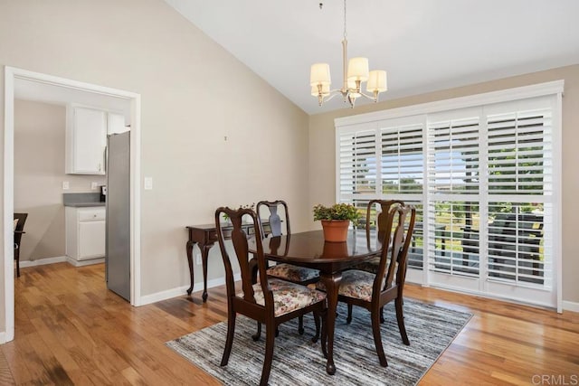 2072 Golden Circle Dr, Escondido, CA 92026 - dining room featuring a chandelier, lofted ceiling, and light wood-style flooring