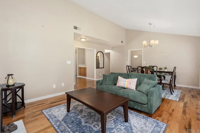 2072 Golden Circle Dr, Escondido, CA 92026 - living area with a chandelier, light wood-type flooring, and high vaulted ceiling