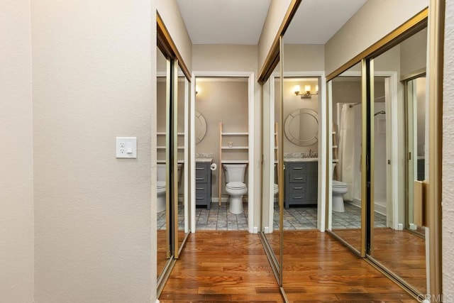 2072 Golden Circle Dr, Escondido, CA 92026 - hall featuring wood finished floors and a sink