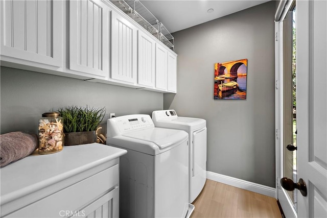 507 Corte Del Oro, San Clemente, CA 92673 - washroom with washer and clothes dryer, cabinet space, and light wood-style floors