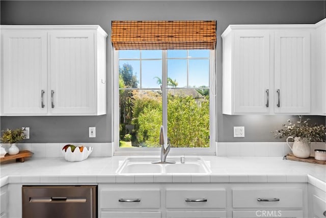 507 Corte Del Oro, San Clemente, CA 92673 - kitchen featuring stainless steel dishwasher, white cabinets, and light countertops