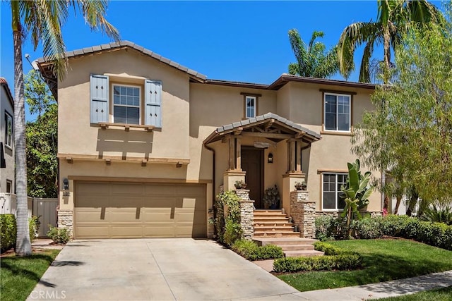 507 Corte Del Oro, San Clemente, CA 92673 - view of front facade with an attached garage, stucco siding, concrete driveway, and stone siding