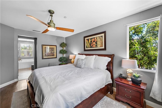 507 Corte Del Oro, San Clemente, CA 92673 - bedroom featuring multiple windows, wood finished floors, connected bathroom, and a ceiling fan