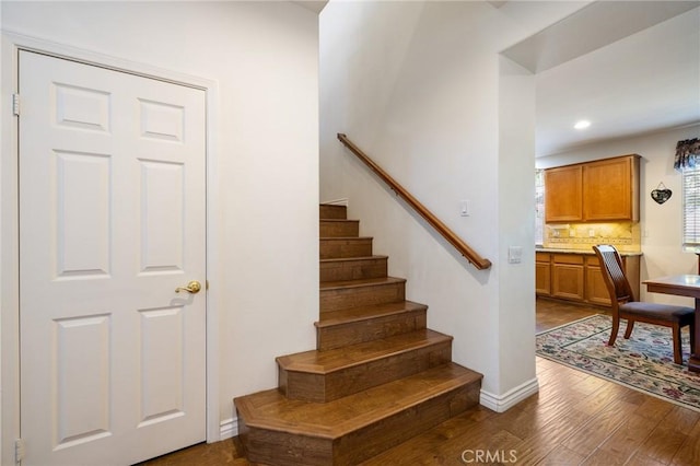 6411 Puma Pl, Rancho Cucamonga, CA 91737 - stairs with wood finished floors and recessed lighting