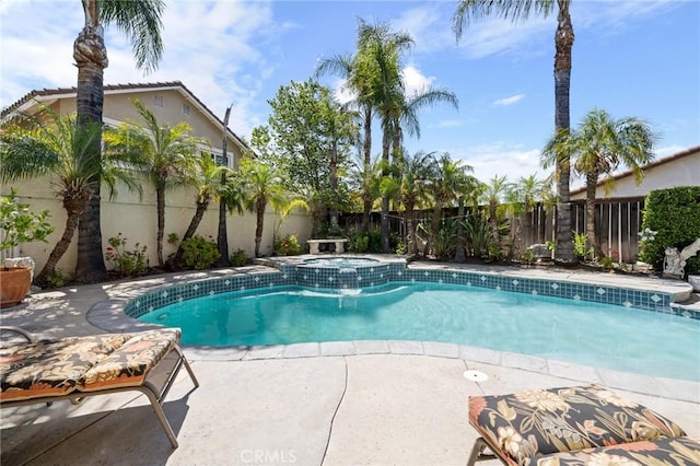 6411 Puma Pl, Rancho Cucamonga, CA 91737 - view of swimming pool featuring a fenced backyard, a pool with connected hot tub, and a patio area