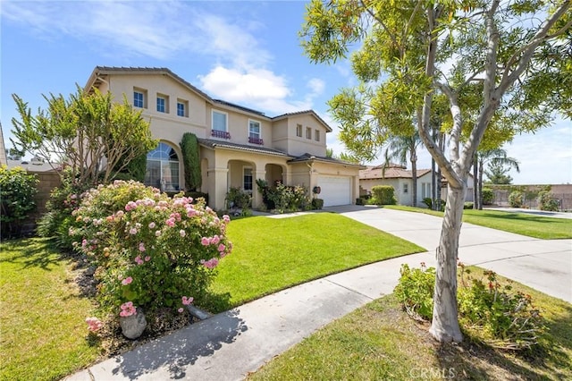 6411 Puma Pl, Rancho Cucamonga, CA 91737 - mediterranean / spanish-style house with driveway, stucco siding, and a front lawn