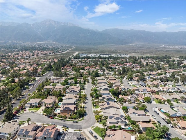 6411 Puma Pl, Rancho Cucamonga, CA 91737 - aerial overview of property's location featuring a mountainous background and nearby suburban area