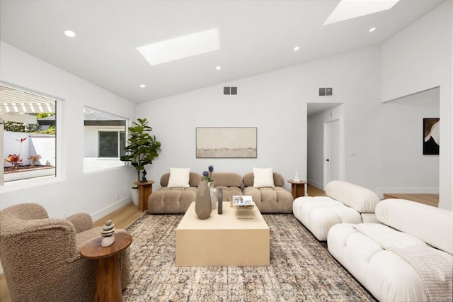 3835 Humboldt Dr, Huntington Beach, CA 92649 - living area featuring a skylight, lofted ceiling, light wood-style flooring, and recessed lighting