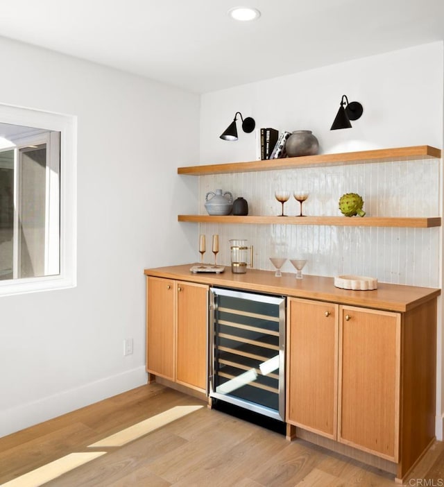3835 Humboldt Dr, Huntington Beach, CA 92649 - indoor dry bar with beverage cooler, light wood-type flooring, and recessed lighting