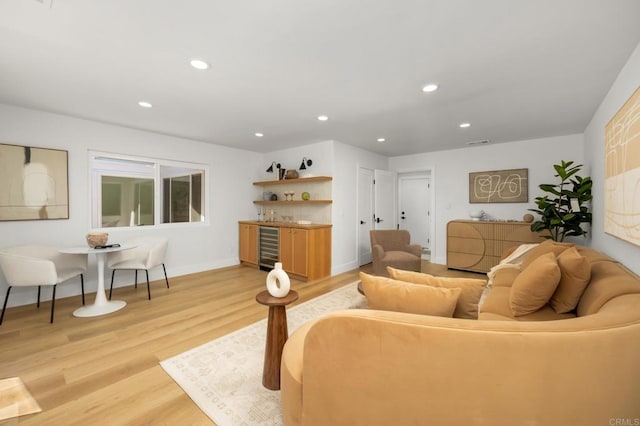 3835 Humboldt Dr, Huntington Beach, CA 92649 - living room featuring light wood-style floors, recessed lighting, bar area, and wine cooler