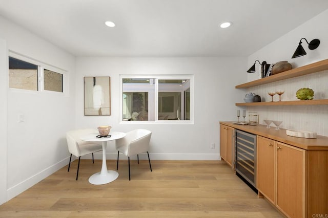 3835 Humboldt Dr, Huntington Beach, CA 92649 - dining room with wine cooler, light wood-style flooring, a dry bar, and recessed lighting