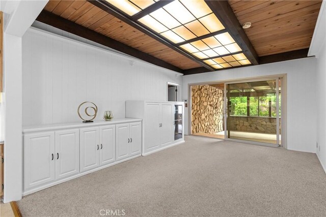 12319 Aneta St, Culver City, CA 90230 - unfurnished living room featuring a wooden ceiling with exposed beams and light colored carpet